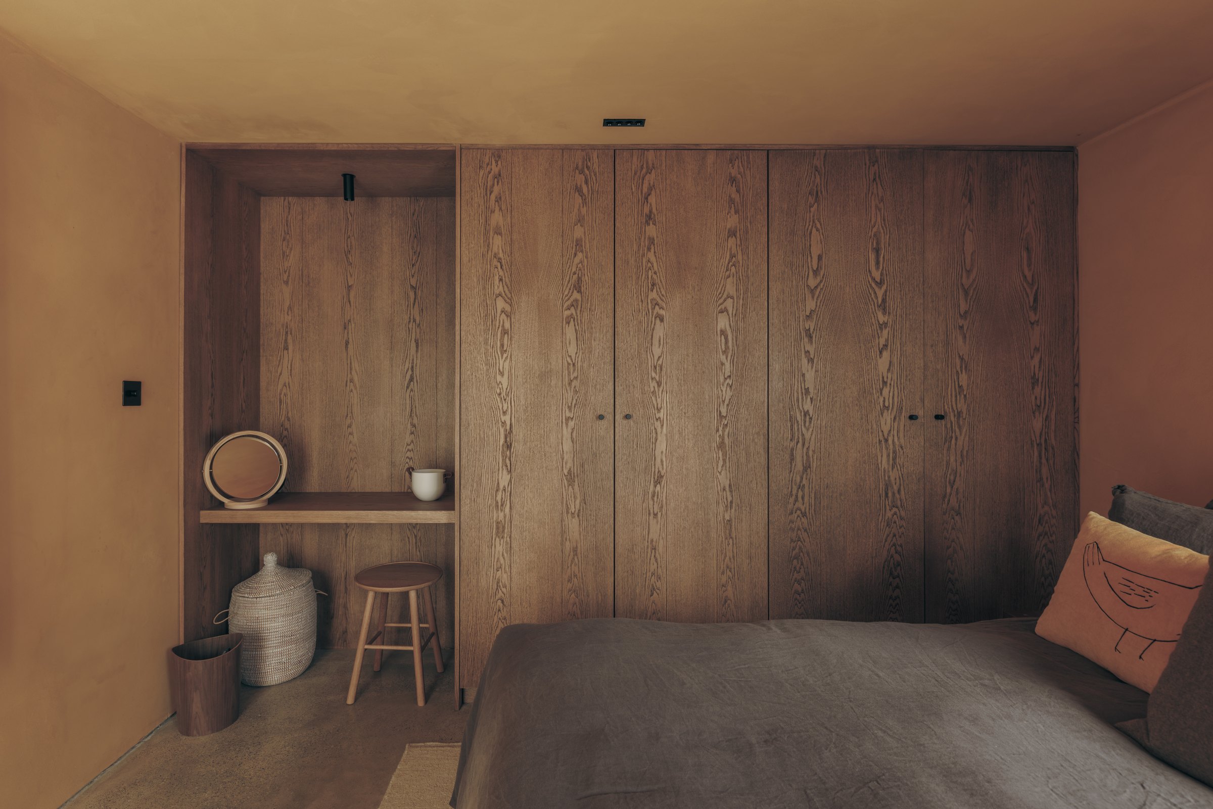 Bespoke timber wardrobes and dressing niche in a Bank Cottage bedroom