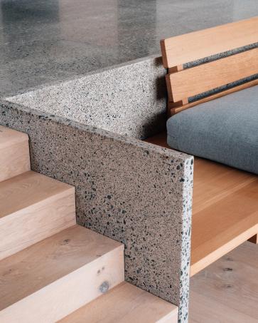 The choice of materials is central to the character and finished quality of this house in the Western Isles. The interiors are defined by three: local-stone terrazzo, oak and clay plaster.

The terrazzo is used across the floor and to form a series of bespoke elements, including the back of the built-in sofa, hearth, kitchen worktops and bathroom vanity units.

Oak provides warmth and contrast, used for areas of flooring, the ceiling linking the main chambers, and throughout the built-in joinery, including the kitchen, doors and study.

The clay-block walls are finished in clay plaster, with micro-cement used within the shower rooms.
As with all our projects, the finished building is the result of close collaboration, shaped by the ambitions of the client and the skills of those involved in its delivery.

Contractor: @omacconstructionlimited, Stornoway
Internal joinery: @56northkitchens and @namongaston
Terrazzo: @skyestonestudio
Furnishings: @tangram_furnishers
Structural engineer: @narroassociates
Building services: @luths.services
Quantity surveyor: The Torrance Partnership

#scottisharchitecture #contemporaryarchitecture #terrazzo #clayblocks #oakinteriors