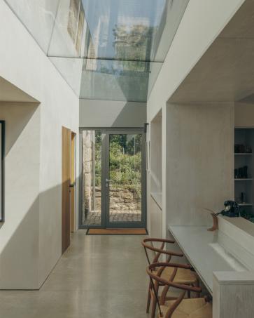 When our clients bought Bank Cottage on Bryher, they inherited a building that had been altered and extended many times over the years.

Somewhere underneath it all was a simple granite cottage, but it had become difficult to see, and the building itself was suffering badly from water ingress.

The idea was to strip away some of those later additions and let the original house breathe again. The granite walls were repaired and exposed, the roof raised slightly to make the upper floor properly usable, and a new timber extension set low into the garden.

A glazed link separates old from new, bringing light into the heart of the house, while larger openings connect the living spaces to the garden and the Atlantic beyond.

The palette is deliberately simple: restored granite and slate for the old house, with untreated timber and glass for the new. The timber will weather naturally, allowing the extension to settle into the extraordinary hedged landscape of Bryher.

Inside, clay plaster and breathable wall build-ups, together with a careful choice of finishes, help create a healthy internal environment.

The quality of the finish is testament to the ambition of our clients and the dedication and skill of builder Phil Spence and the craftspeople who took on the work.

And a wee nod to royalty too. The first planning application was withdrawn and redesigned to gain the consent of not only the planners but the then Duchy of Cornwall.

Thank you for the approval King Charles. We hope you like it.

Images: Richard Gaston @richardgaston 

 #Bryher #IslesOfScilly #BritishArchitecture #contemporaryarchitecture #modernrenovation