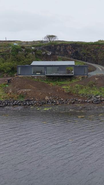 Work is nearing completion at Taigh a’ Chladaich, perched quietly above the shore of Loch Greshornish.
Just a few finishing touches remain: a monolithic fireplace between the windows, black metal decking panels aligned with the wall cladding, and a corten rolling storm shutter to close off the mouth of the tunnel separating the main bedroom from the living quarters.
Our clients are gradually filling their home with beautiful objects, including a multi-race-winning Yoshimura-Suzuki Superbike, an AV console by Reed LaPlant Studio, and an assortment of furniture chosen to match the cat.
#scottisharchitecture #scottishhighlands #modernhome #modernarchitecturedesign #roomwithaview